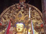 Tibet Lhasa 02 08 Jokhang Inside Maitreya The inner sanctum of the Jokhang houses its most important images and chapels. In the central area is a large seated statue of Maitreya, the Future Buddha, with a photo of the Tenth Panchen Lama in his lap. Although theres no photography allowed, heres a photo from my 1993 trip.